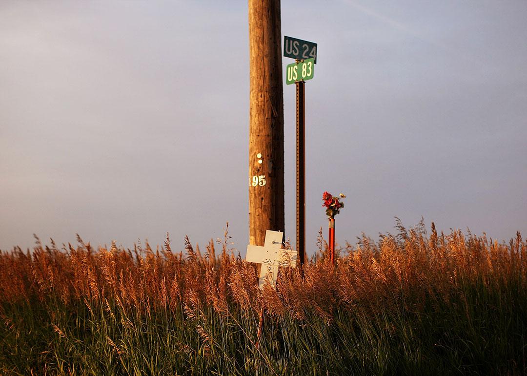 A cross marks the spot where people lost their lives in a car crash in Colby, Kansas.