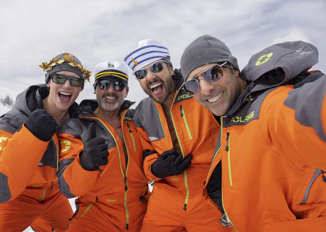 enis (Cory Michael Smith), Randall (Steve Carell), Jeff (Ramy Youssef) and Souper (Jason Schwartzman), from left, dressed in orange jackets in the show Mountainhead.