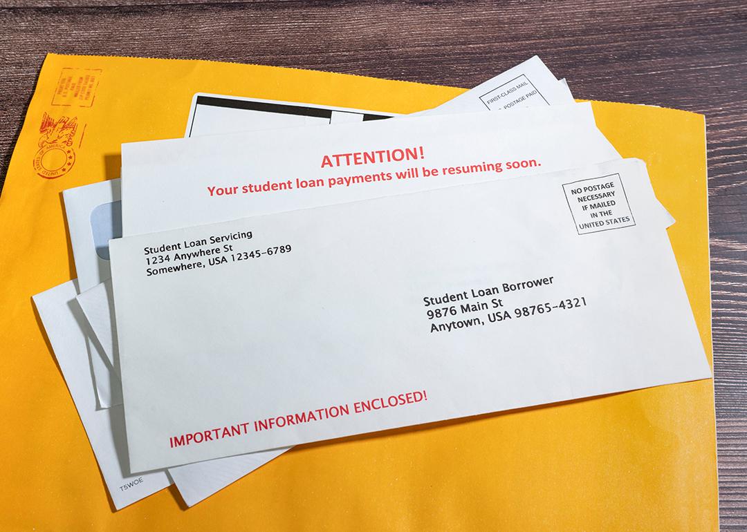 Pile of student loan notices sent by mail.