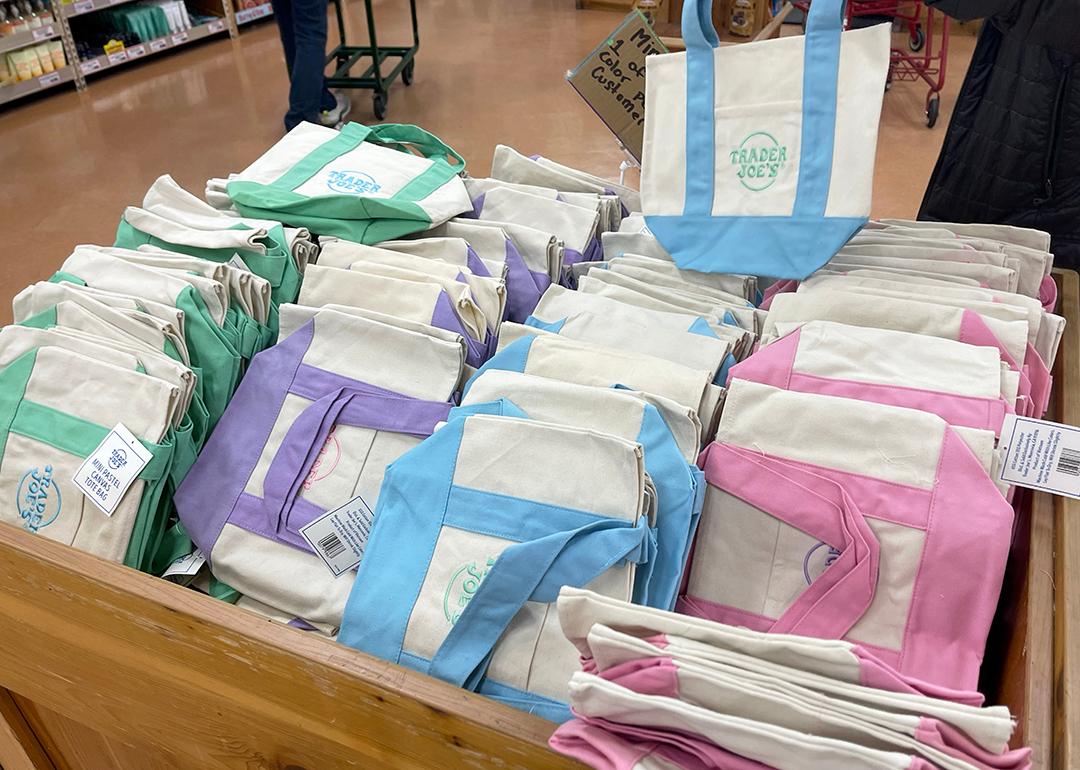 The viral Trader Joes mini pastel canvas tote bags for sale.