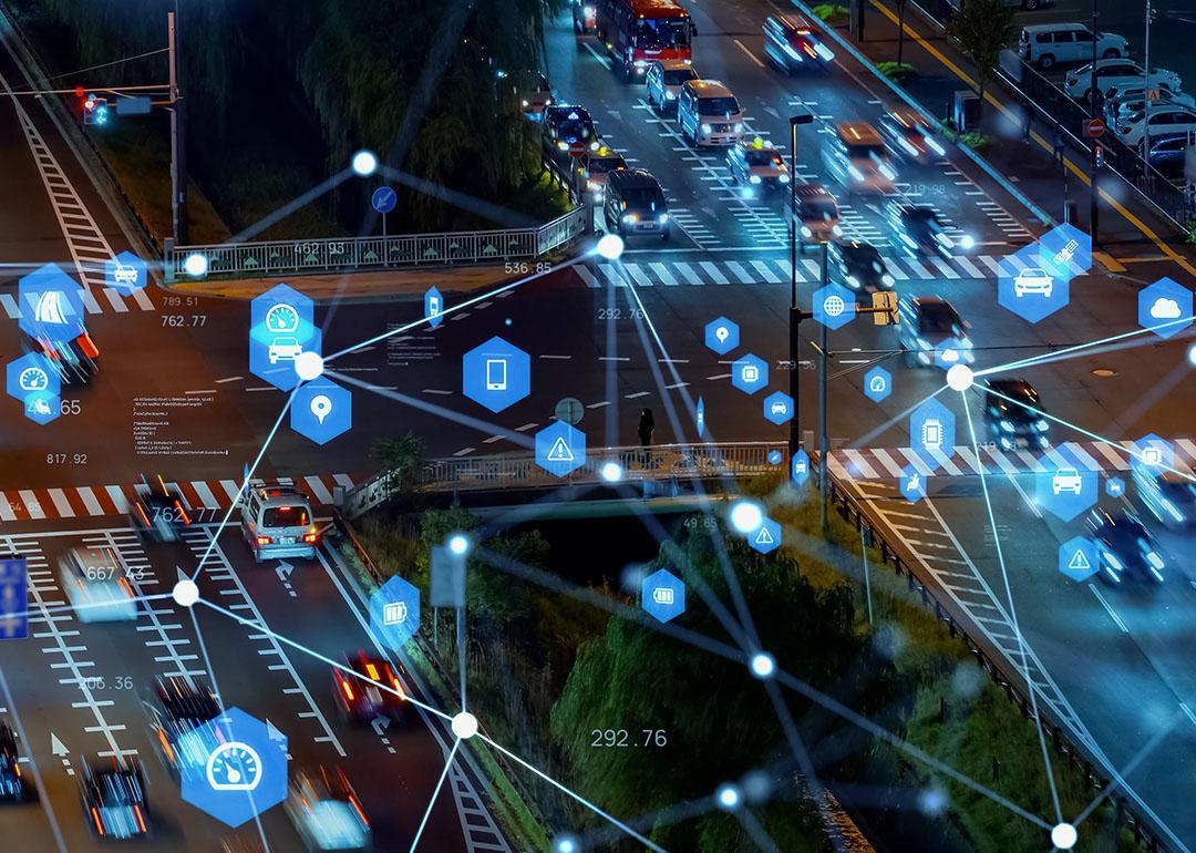 Cars on road during nighttime illustrated with tracking technologies.