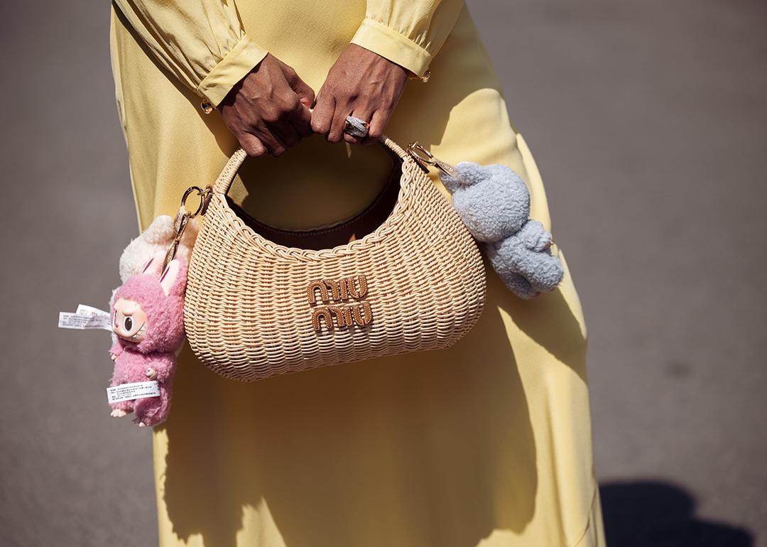 Zufi Alexander's straw Miu Miu bag attached with Labubu charms.