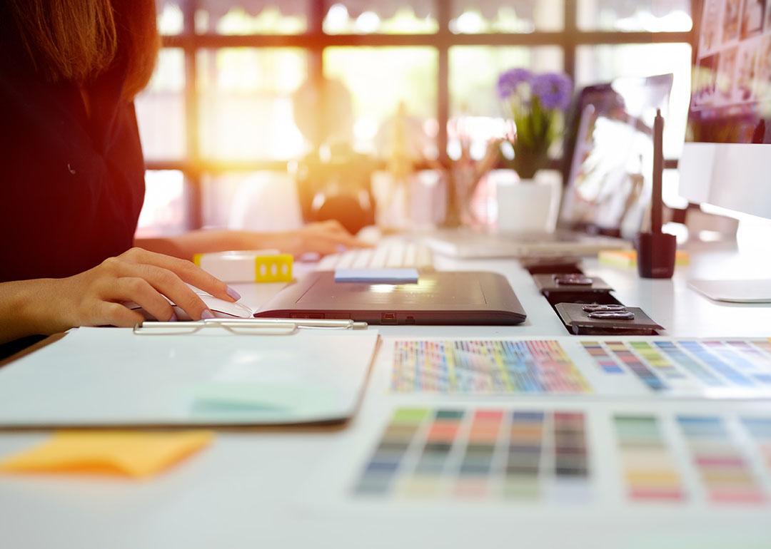 A young graphic designer at work in office.