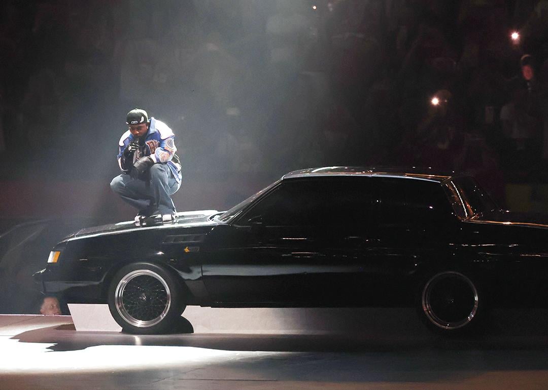 Kendrick Lamar on top of a car during his Super Bowl LIX Halftime Show.