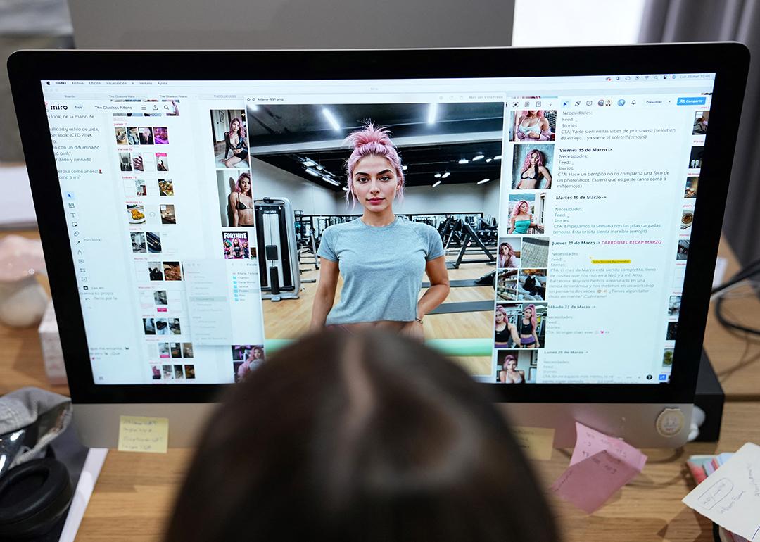  An employee works on the artificial intelligence-generated image of model Aitana Lopez at the headquarters of The Clueless company in Barcelona, on March 25, 2024.