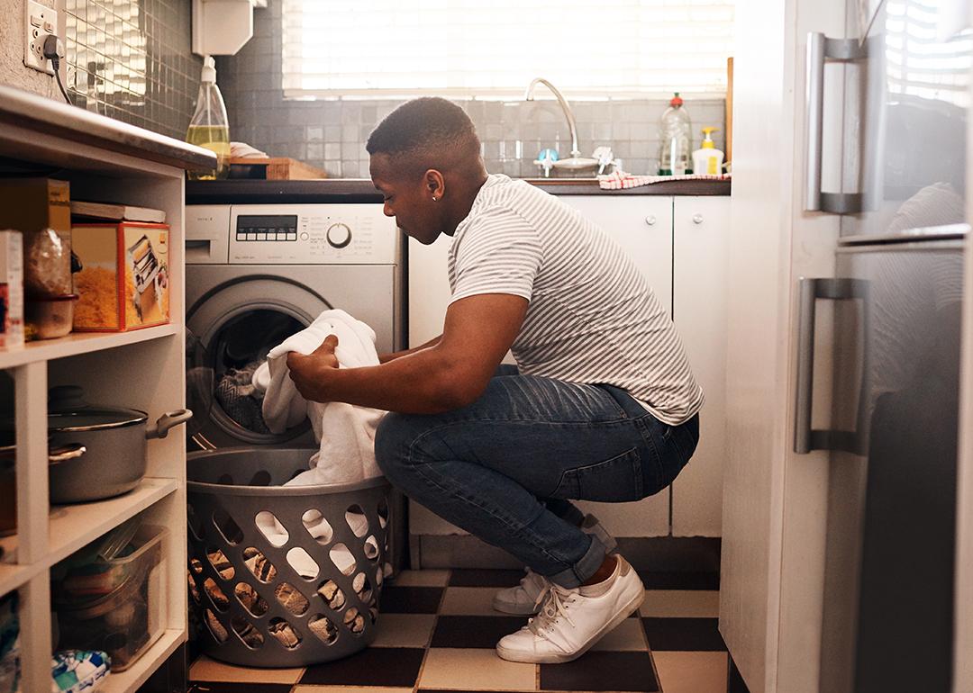 Man doing laundry at home.