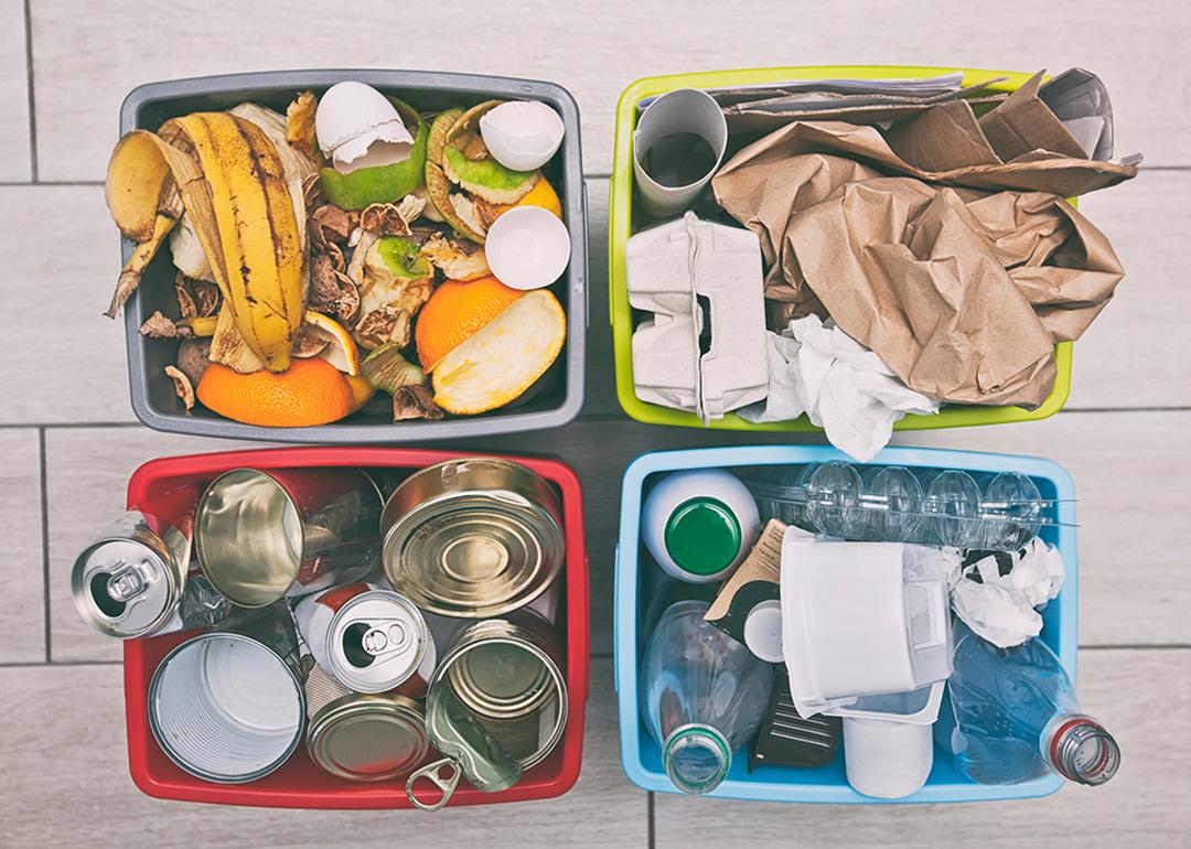 Four different container for sorting garbage for plastic, paper, metal and organic waste