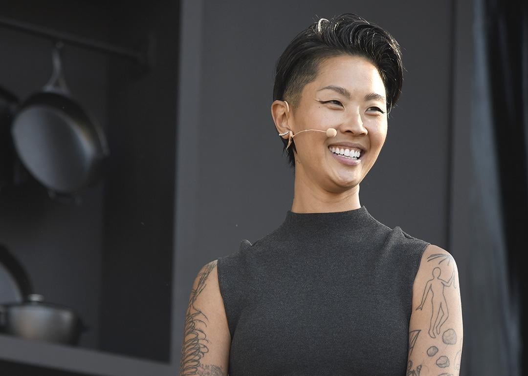 Chef Kristen Kish, wearing a black sleeveless mock turtleneck and mic headset speaks at a culinary demonstration during the 2025 Bottle Rock Napa Valley festival.