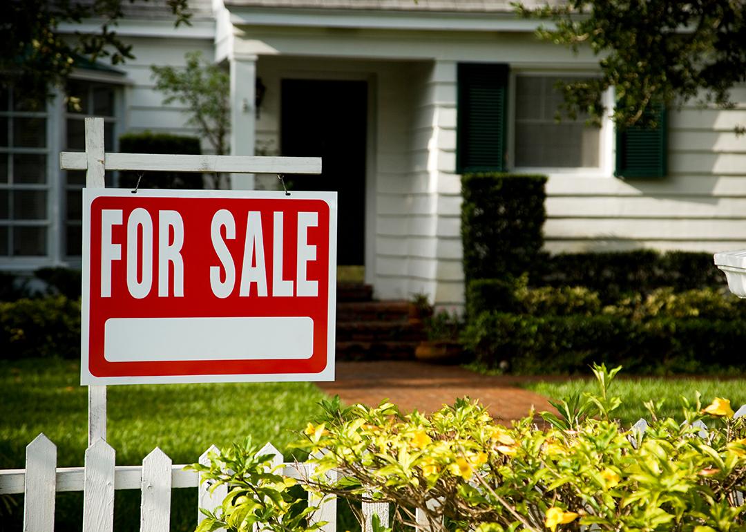 For sale sign in front of a house.