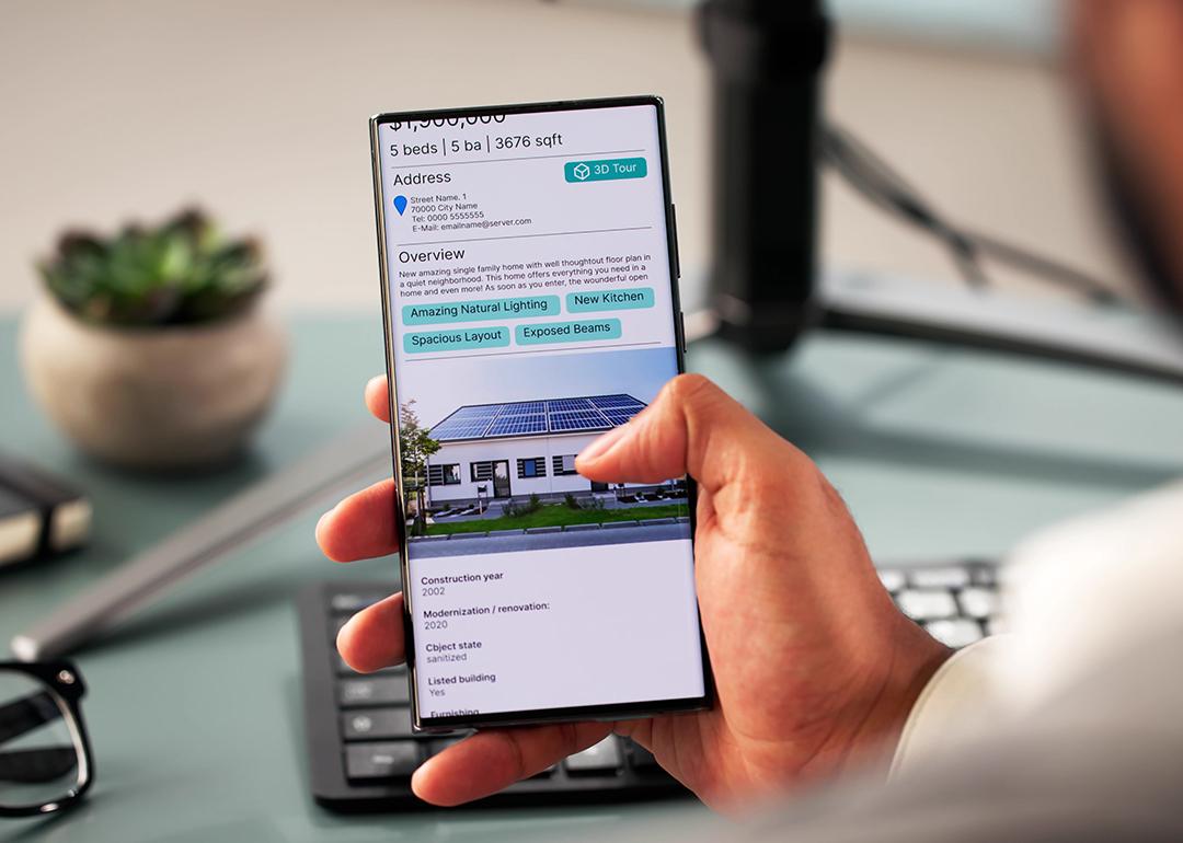 Person looking at the details of a house online.