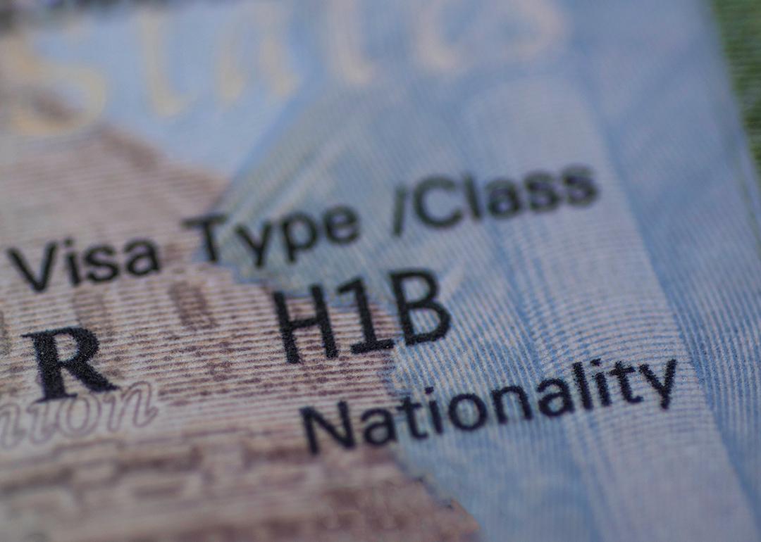 Stamp of an H1B worker's visa on a passport.