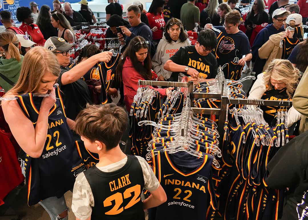 Fans looking at the merchandise in the team store before the game between the New York Liberty and the Indiana Fever at Gainbridge Fieldhouse, Indiana.