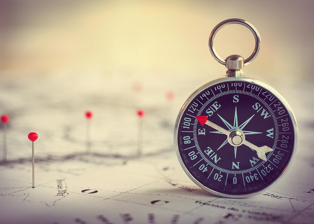 Magnetic compass on a world map.
