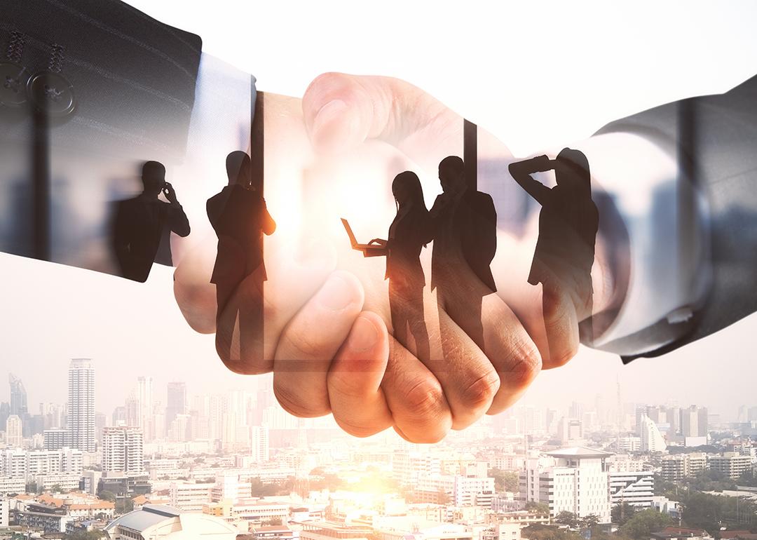 Illustration of businesspeople and a handshake.