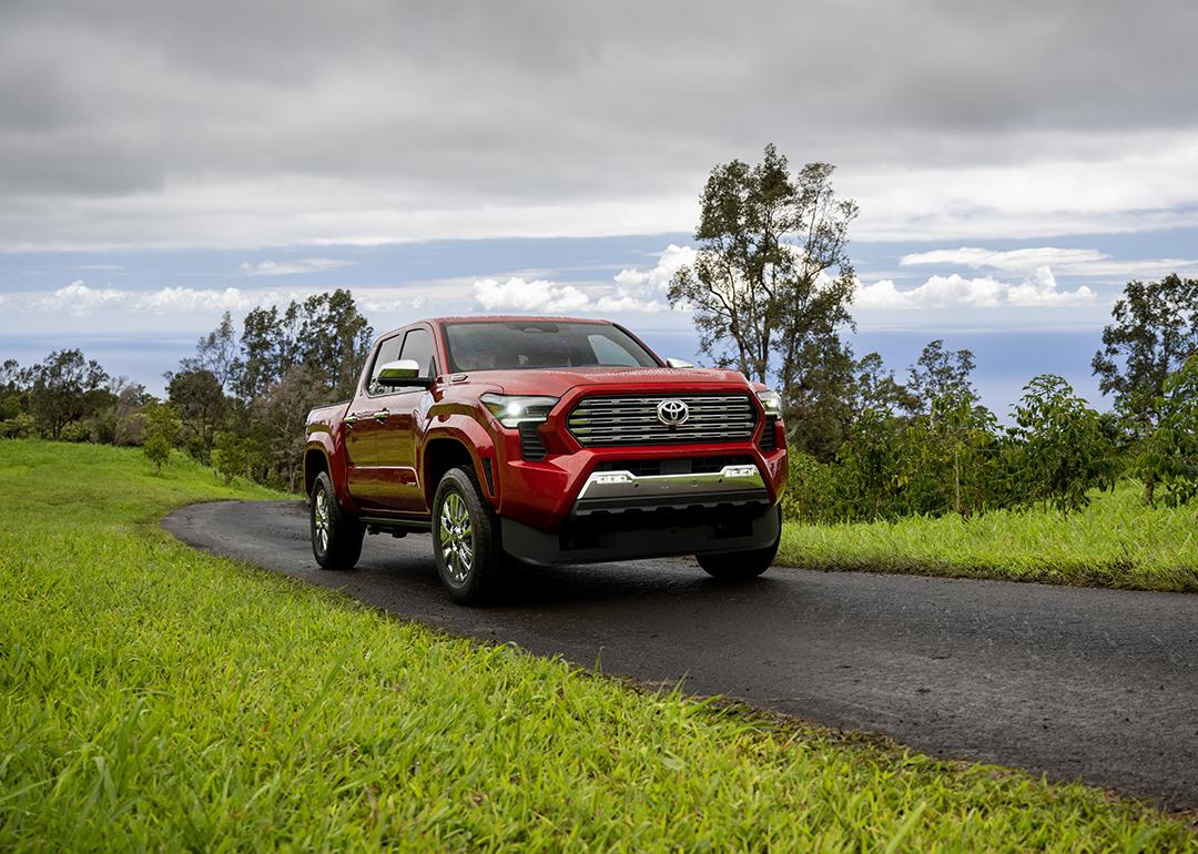 A red 2025 Toyota Tacoma on the road.
