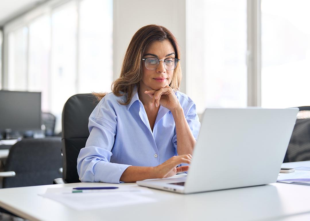 Middle-aged businesswoman in a corporate office.