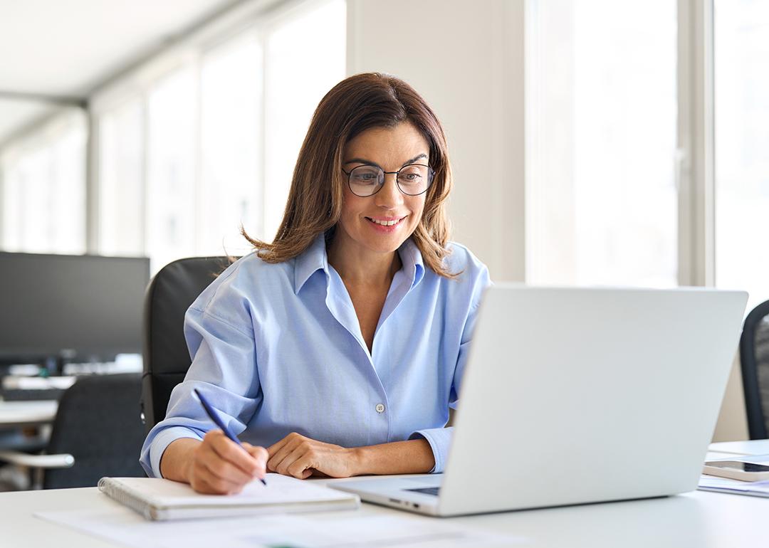 Middle-aged businesswoman working in a corporate office.