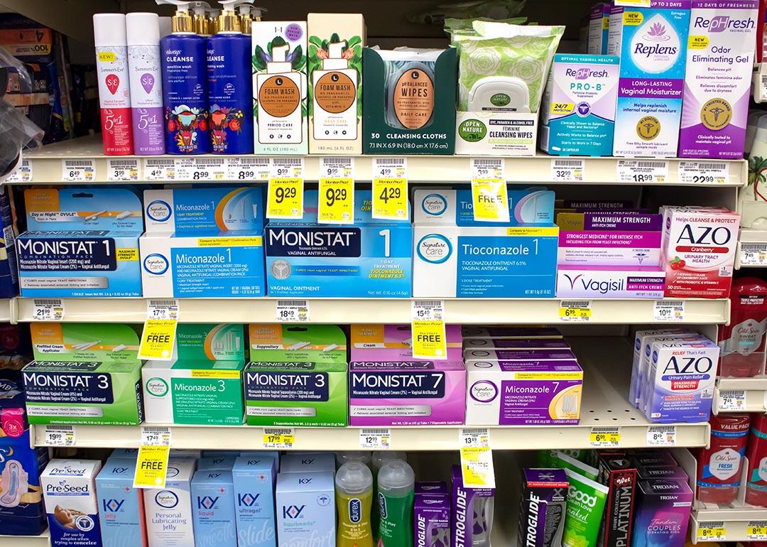 A view of several shelves dedicated to yeast infection products in a drugstore.