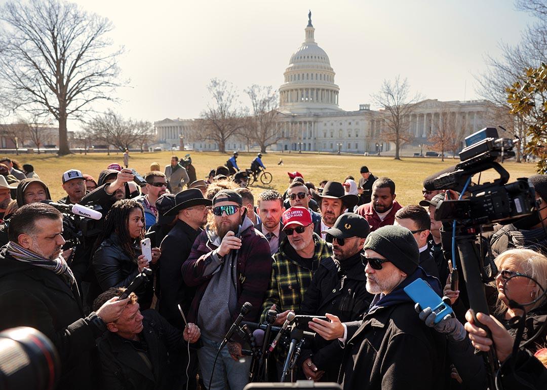 Members of the far-right group the Proud Boys, including their former leader Enrique Tarrio, Stewart Rhodes, Joe Biggs, Ethan Nordean and Zach Rehl speak to journalists on the east side of the U.S. Capitol, Feb. 2025.