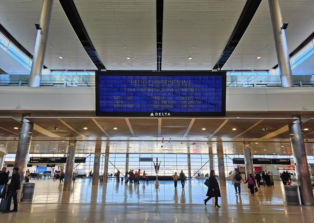 View of the Parallel Reality Experience, a personalized large screen monitor with flight information for Skymiles members at the Salt Lake City Airport.