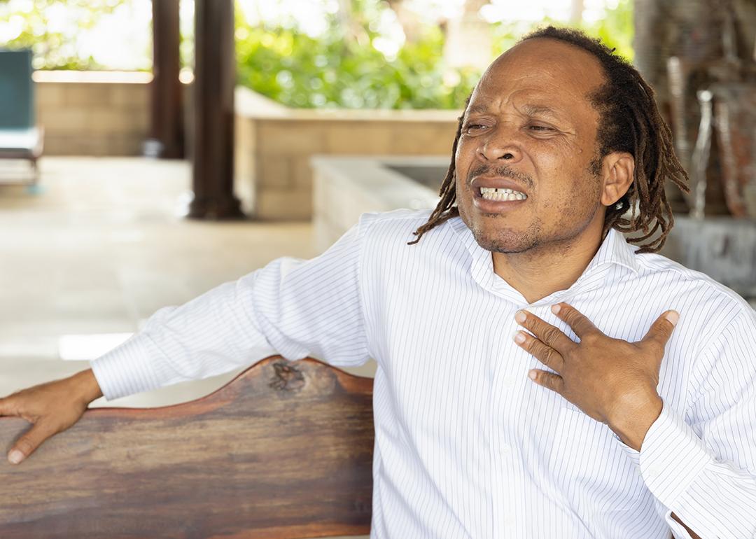 A middle-aged man suffering from acid reflux.