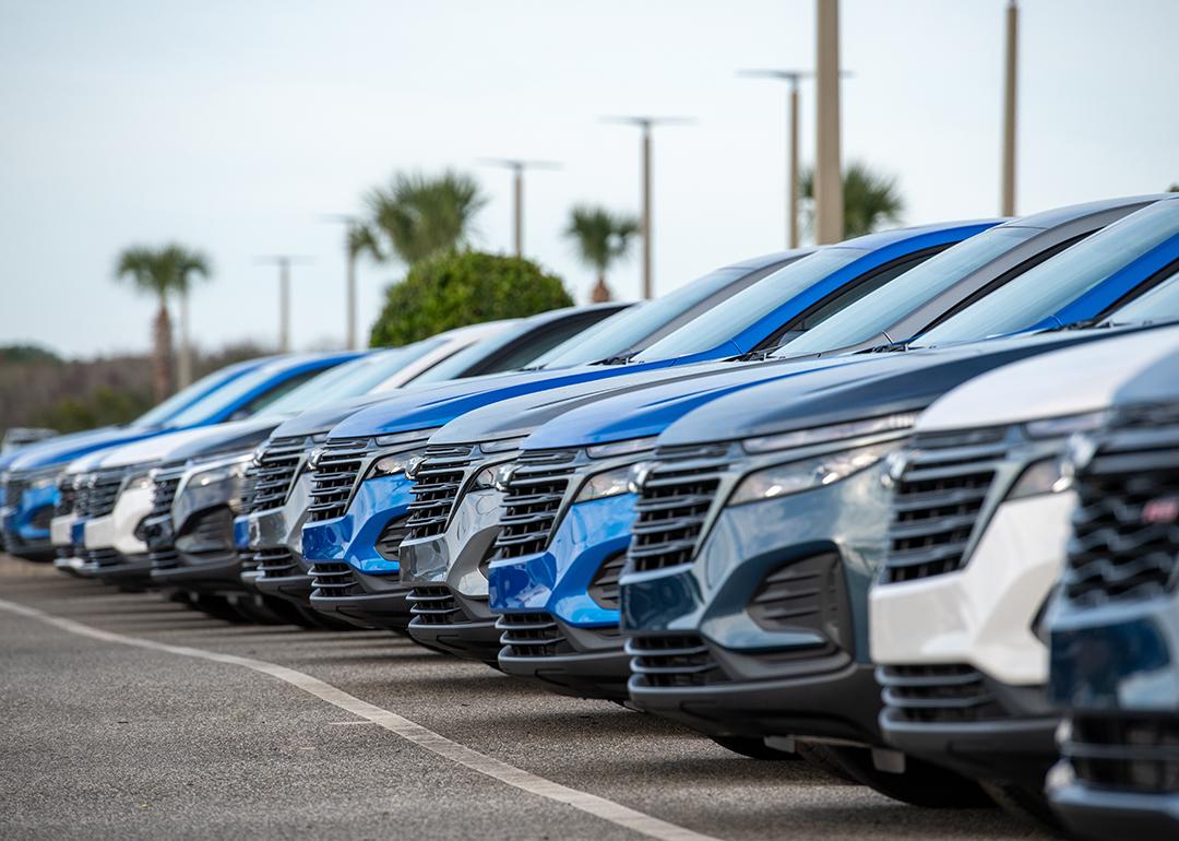 A row of Chevrolet Bolt EUV utility vehicles on a car dealership's parking lot.