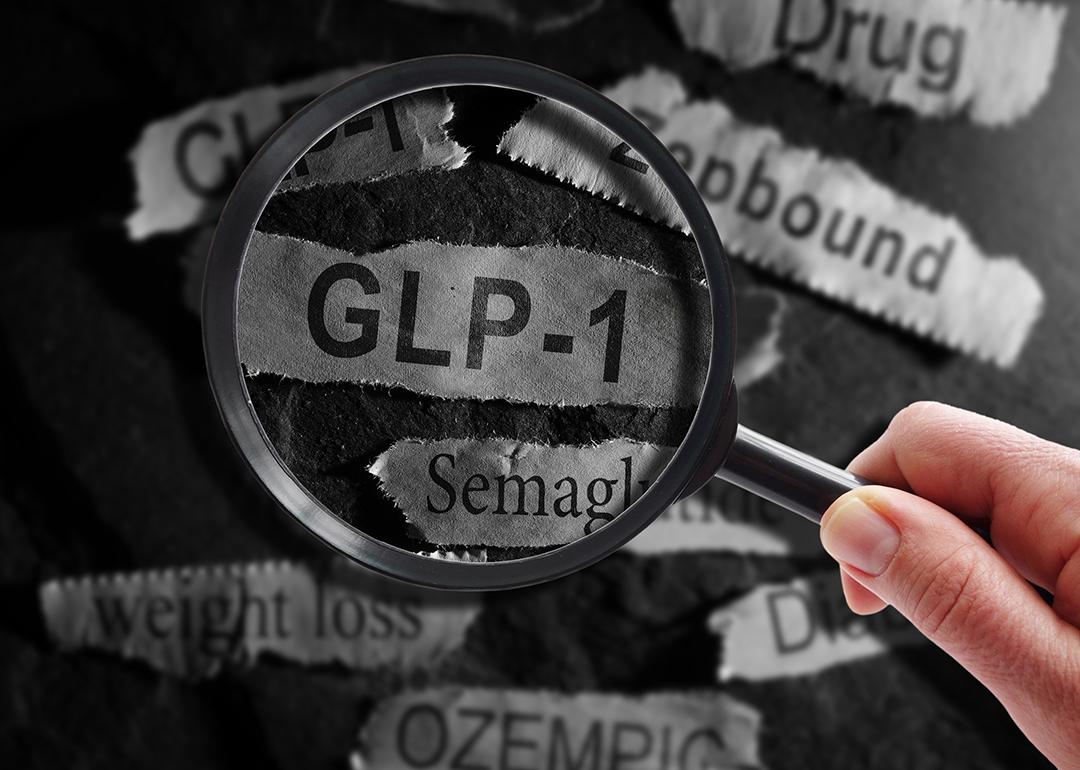 A magnifying glass over a ripped out piece of newspaper headline writing "GLP-1".