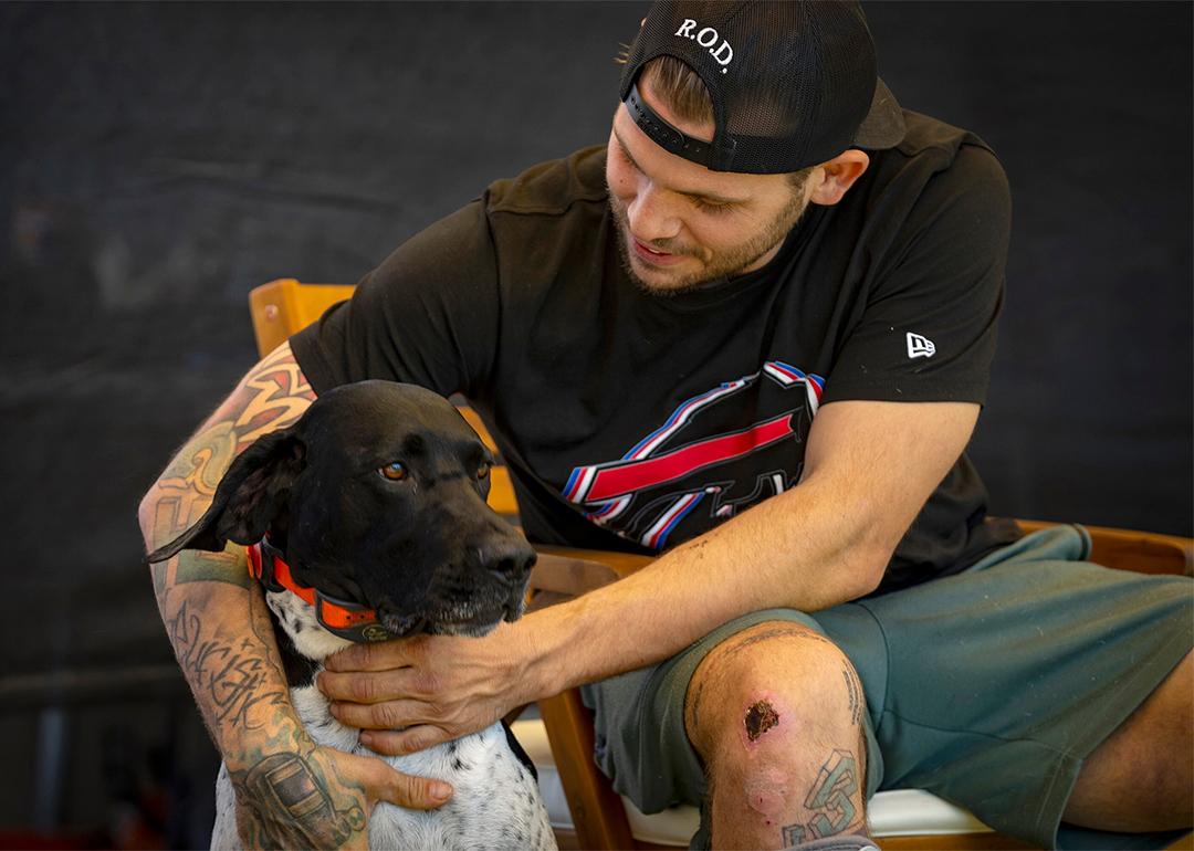 Jacob Schmitt with his dog Buddy, at his home in Ogden, on Thursday, July 31, 2025.