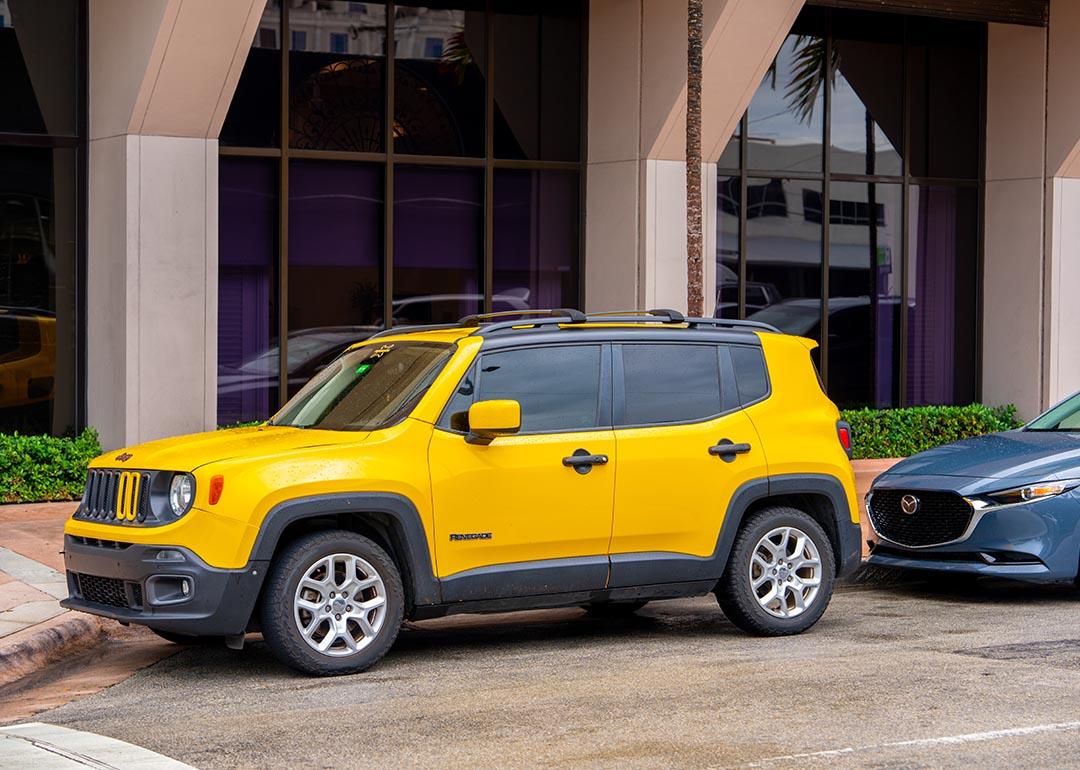 Yellow Jeep Renegade SUV parked in FL.