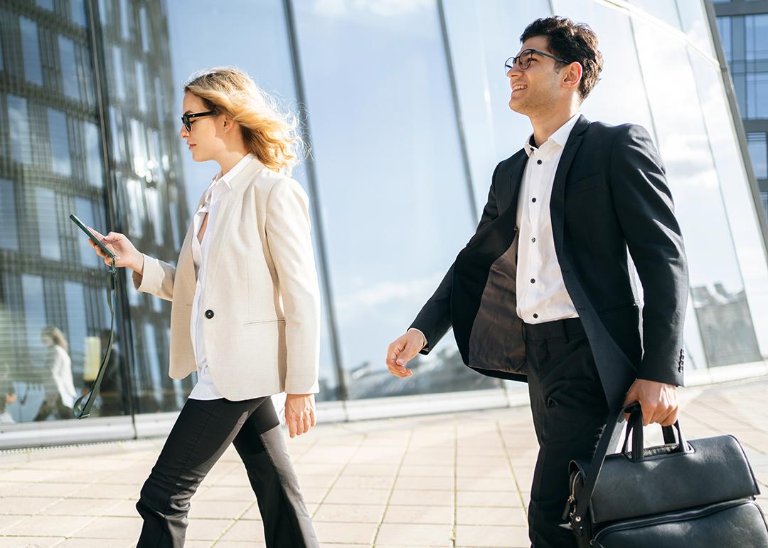 Two business professionals on the way to their work.