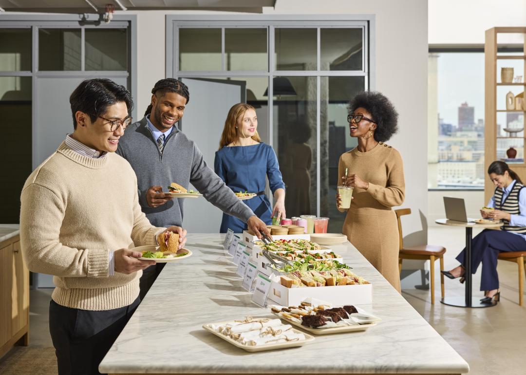 Office workers enjoying a catered lunch
