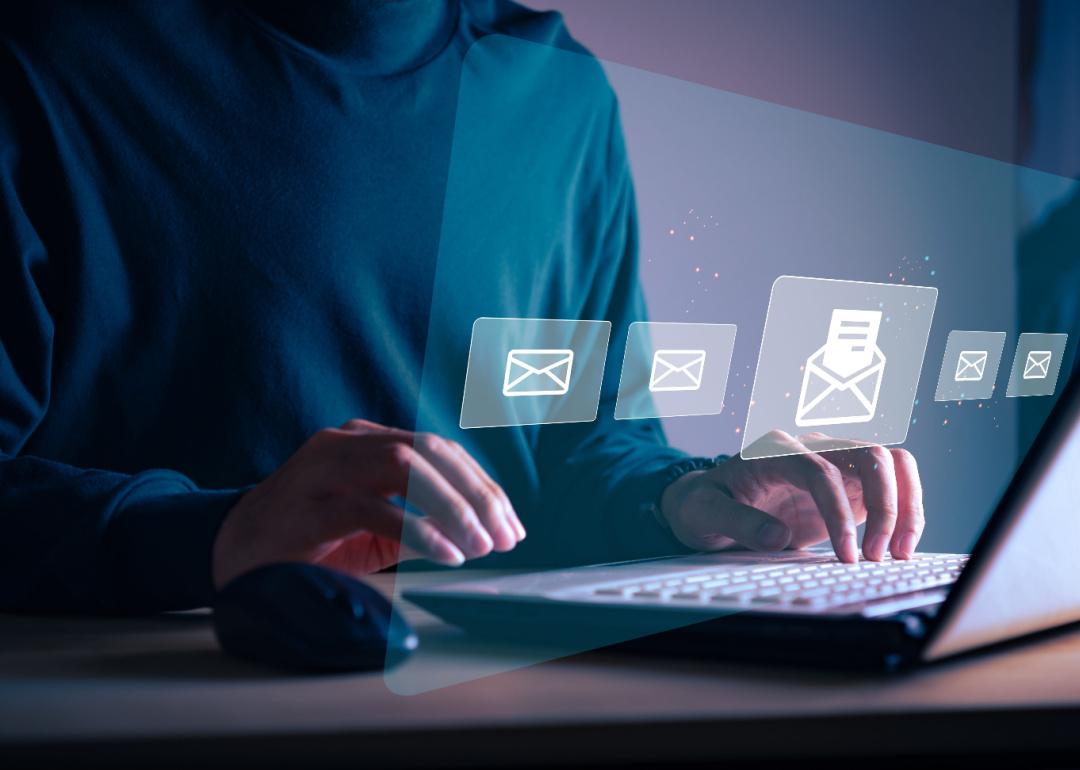 Businessman sending email to customer.