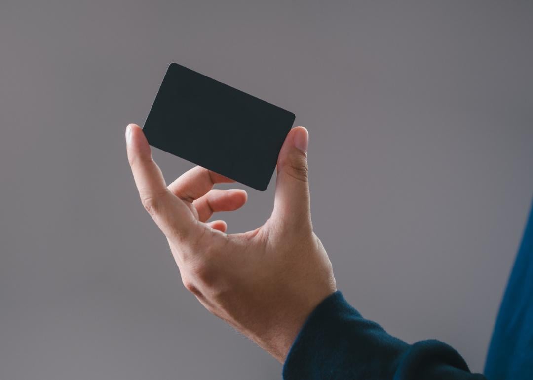Hand holding a credit card.