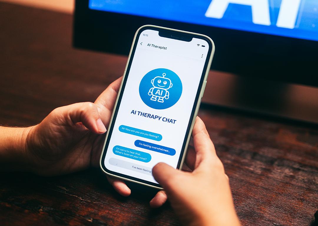A smartphone showing an AI therapy app conversation.