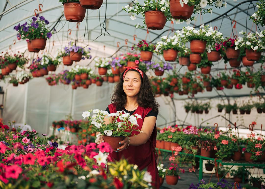 A small business owner in her flowers and plants site.