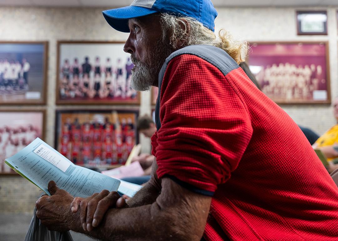 James Wolcott, a patient waits to take a vision test for a new pair of glasses at a Remote Area Medical (RAM) mobile dental and medical clinic at Terre Haute South High School, Indiana.