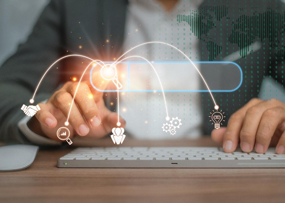 Person using a keyboard illustrated with data search technology graphics.