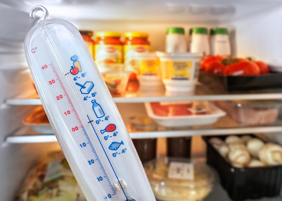 A temperature in front of an open refrigerator.