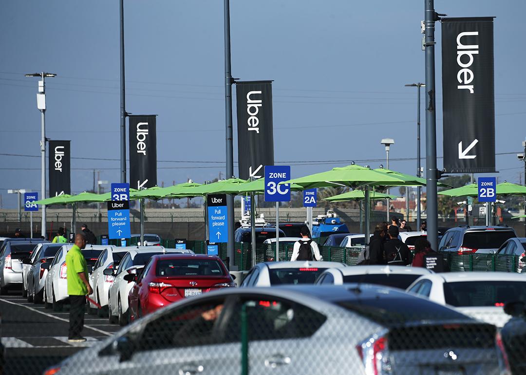 Uber vehicles lined up at the new 'LAX-it' ride-hail passenger pickup lot at Los Angeles International Airport (LAX), California.