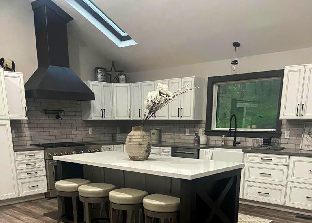 A modern kitchen with a sloped ceiling.