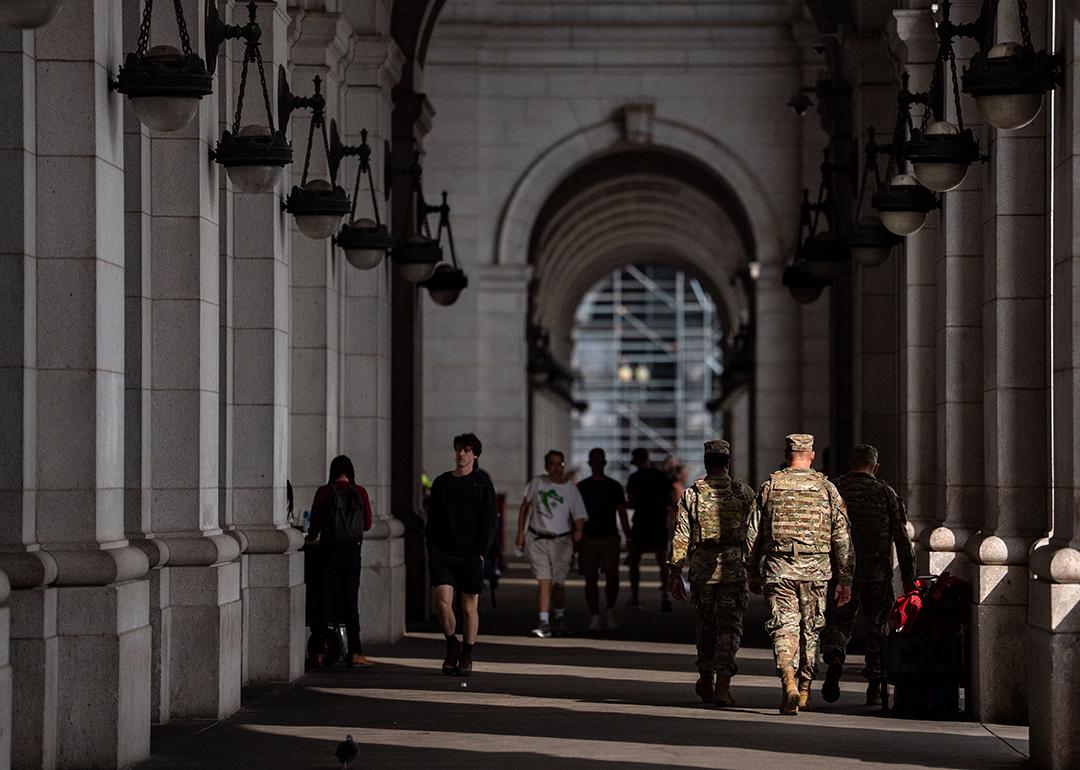 Members of the National Guard and members of Federal Law Enforcement Agencies stand outside the main hall of Union Station in Washington, D.C.