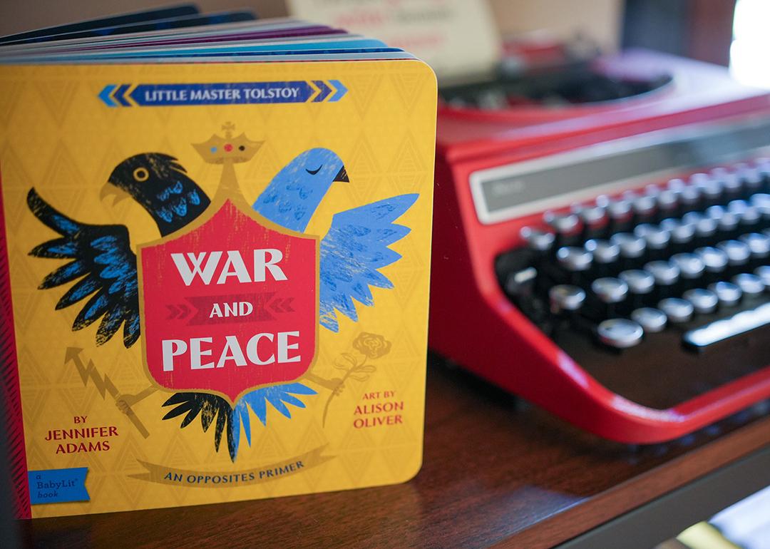 A version of Tolstoy's 'War and Peace' by Jennifer Adams as a children's book, beside a typewriter.