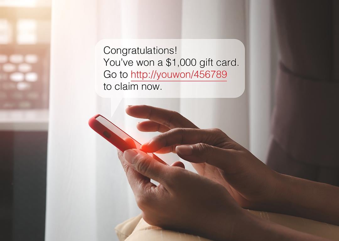 SMS chat bubble displaying a cash prize message over a person typing on a smartphone.
