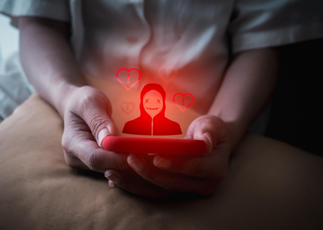 A person using a smartphone illustrated with a red anonymous identity graphics.