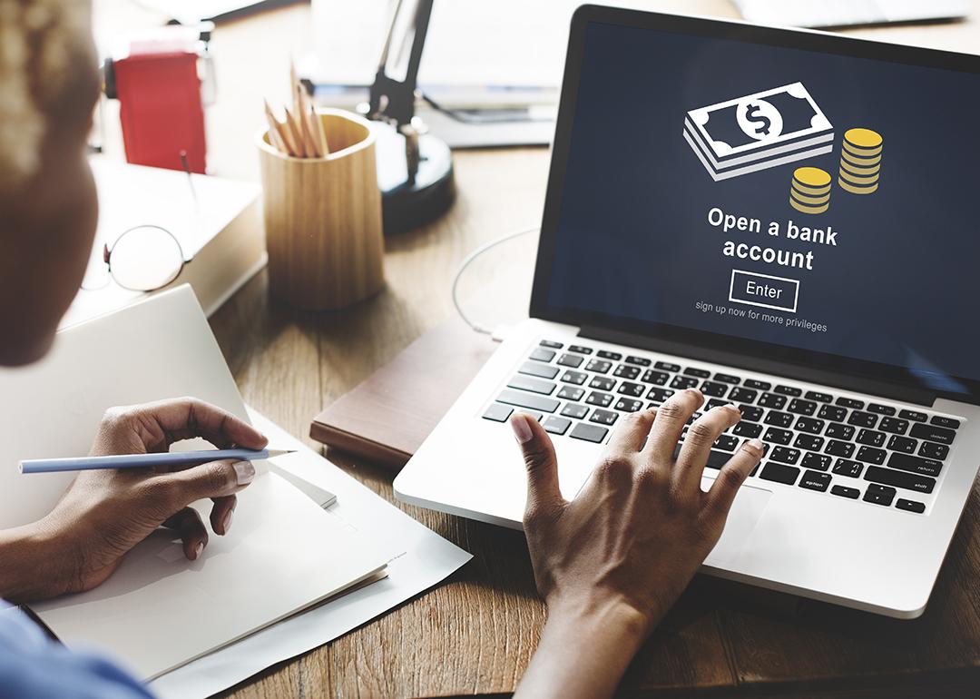 A businesswoman navigates a page to open a bank account.