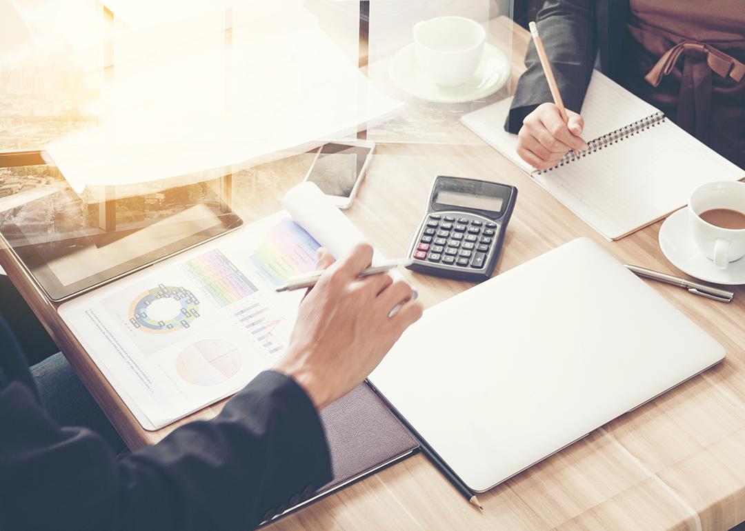Business partners review financial documents.