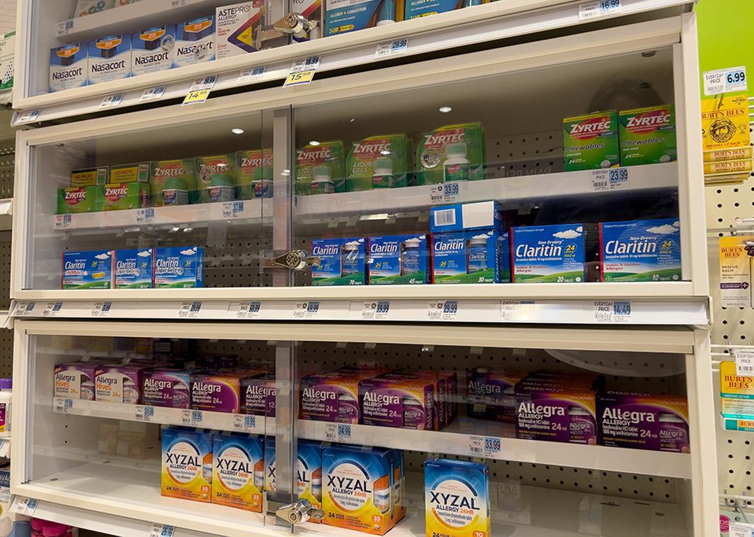 Xyzal and Zyrtec inside a pharmacy shelf with other allergy and sinus products.
