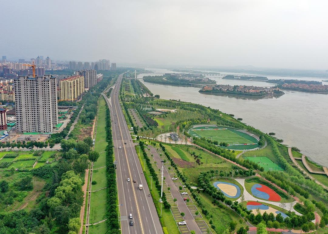 Aerial photo taken on July 31, 2021 shows a vegetation buffer belt at the Huangtaihu Lake water conservation scenic spot in Qian'an City of north China's Hebei Province, as an example of "sponge city construction." Following the principle of precipitation reserving, permeating and clarifying in natural ways, the local authority set out to build a city that "breathes."