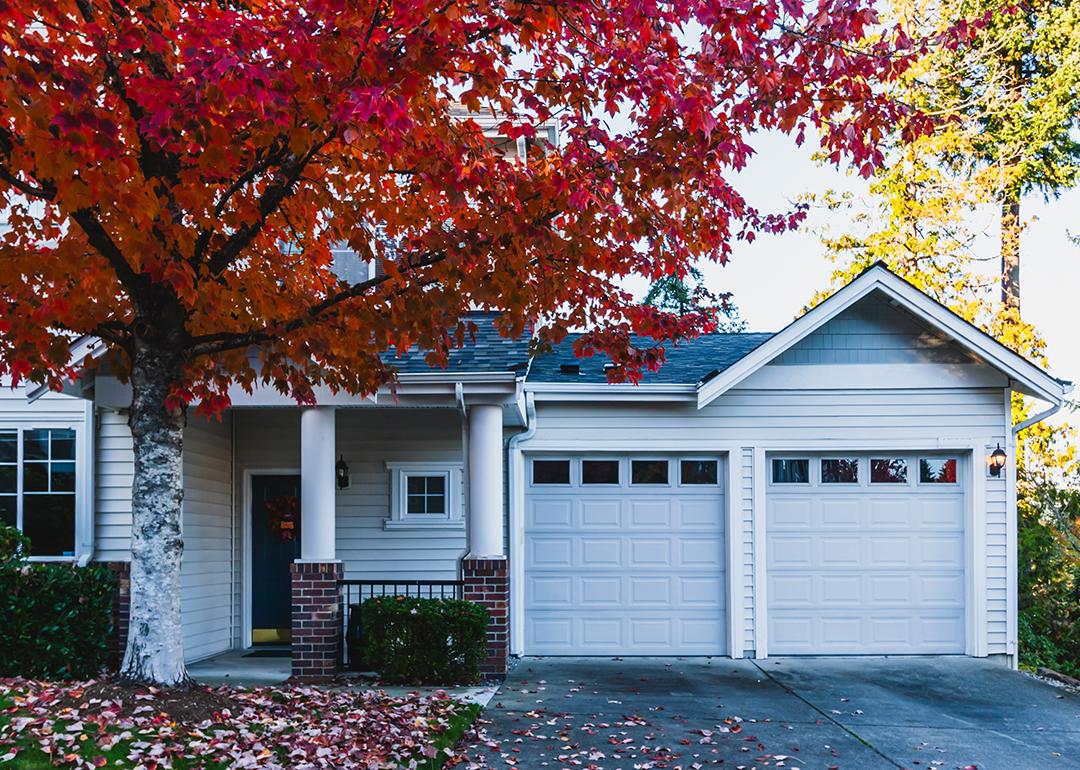 The front of a modern residential home during fall time.