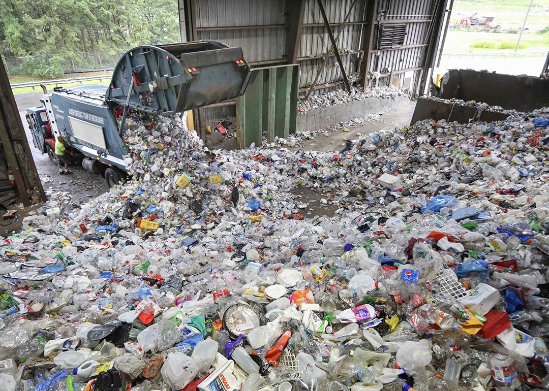 A truck dumps recyclable items at the Brookhaven Material Recycling Facility in Yaphank, New York.